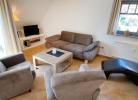 Wohnbereich mit Couch, Flatscreen, Sat-TV, Radio, CD